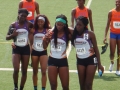 17-18 women 4x400 team coming off the track
