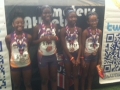 9-10 girls with their 4x400 relay medals